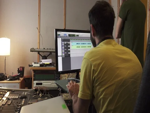 Sound Engineer in Recording Studio with Audio Editing Software Stock Footage 74658802