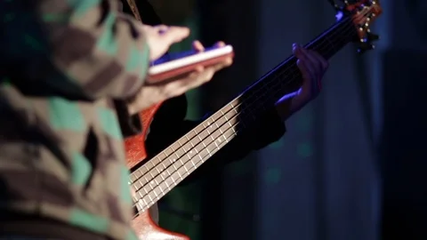 Sound engineer uses a tablet on the stage soundcheck, controls the sound of the Stock Footage 88023754