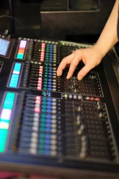 The sound engineer at work behind a mixing console at a concert Stock Photos
