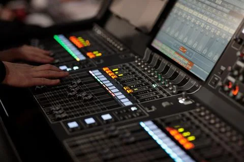 Sound engineer at work with digital mixing console Stock Photos