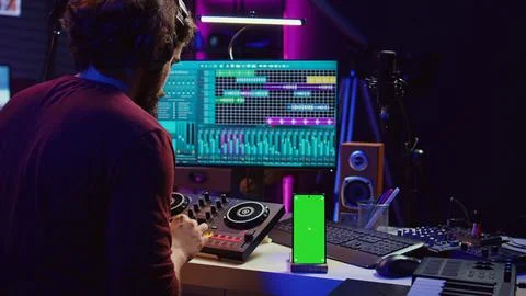 Sound engineer working on mixing and mastering techniques in his home studio 스톡 사진
