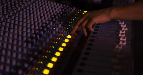 Sound engineer working at a mixing desk Stock Footage 122904137