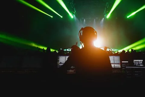 Sound engineer working at mixing panel on a big concert. Stock Photos