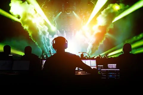 Sound engineer working at mixing panel on a big concert. Stock Photos