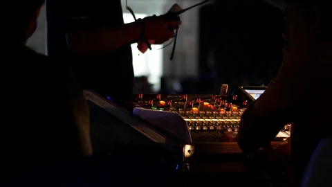 Sound engineer working to prepare for music concert stage. 4K Stock Footage 121490513