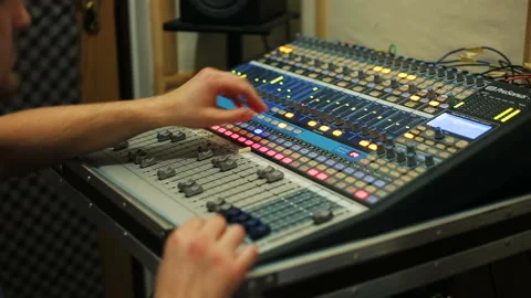Sound engineer working in recording studio, audio mixer in a studio Stock Footage 93509812