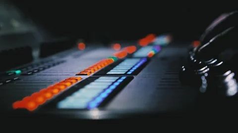 The sound engineer's fingers on the control knobs of a mixing console Stock Footage 252713168