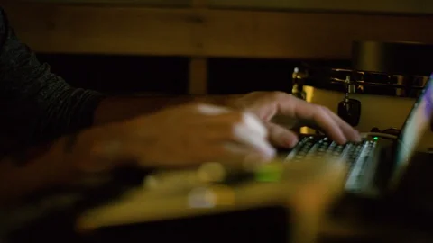 Sound engineers hand working on laptop in the recording studio Stock Footage 108915903