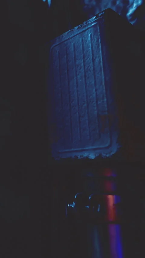 Sound equipment setup in a dimly lit music studio during evening hours Video stock 334110148