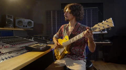 Sound post production. Creative world. Musician. Latin man playing guitar in the Stock Footage 143005657