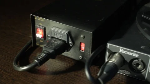 Sound studio technician is preparing all settings on the mixing desk and on the Stock Footage 89197101