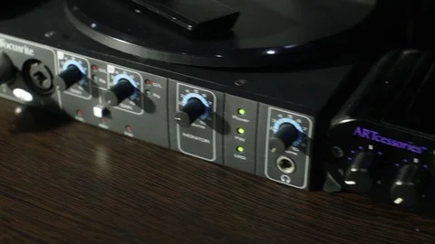 Sound studio technician is preparing all settings on the mixing desk and on the Stock Footage 89197155