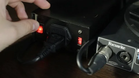 Sound studio technician is preparing all settings on the mixing desk and on the Stock Footage 89197365