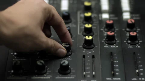 Sound Technician Adjusting the Knobs on a Console at a Radio and TV Station. 4K. 스톡 동영상 276634413
