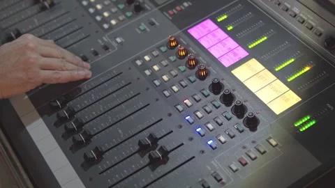 Sound technician hands controlling a digital audio mixing console. Stock Footage 247203512