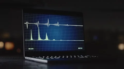 Sound waveforms on laptop screen at night in dark office wiretapping operation Stock Footage 311538210