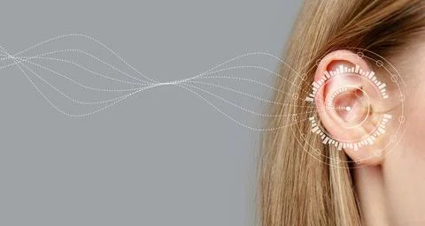 Sound waves interact with human ear showcasing advanced audio technology in a Stock Photos