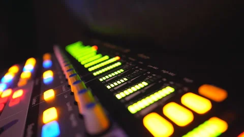 Soundboard with knobs and green color equalizer in night club. Audio waves 스톡 동영상 306047383