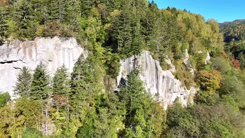 Sounkyo Gorge │ Columnar Jointing │ Cliff Face │ Aerial Pan │ 4K Stock Footage 329049083