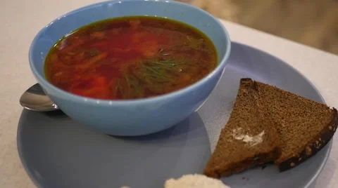 Soup in a blue plate Stock Footage 68781571
