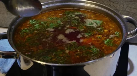 Soup in a blue plate Stock Footage 68781621