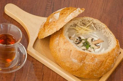 Soup in a bread bowl on the board Fotos Stock