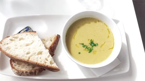 Soup with Bread Stock Footage 164446374