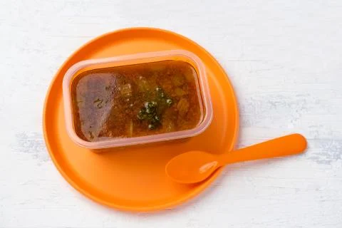 Soup with celery in a plastic box Stock Photos