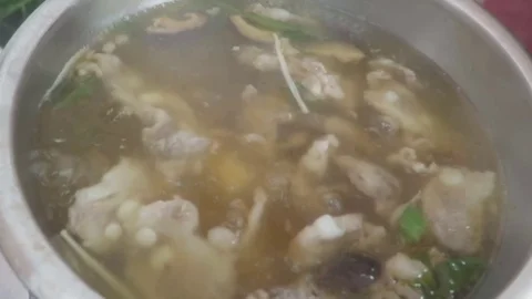 Soup cooked with pork chops Stock Footage 70613405