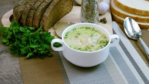 Soup decorated with fresh vegetables and bread. Stock Footage 81302175