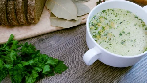 Soup decorated with fresh vegetables and bread. Stock Footage 82090307