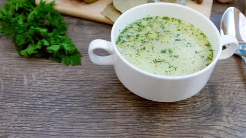 Soup decorated with fresh vegetables and bread. Stock Footage 82090344