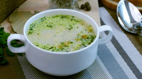 Soup decorated with fresh vegetables and bread. Stock Footage 82090392