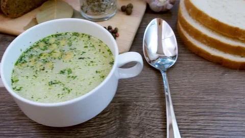 Soup decorated with fresh vegetables and bread. Stock Footage 82719561