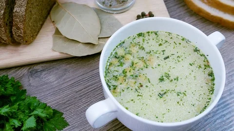 Soup decorated with fresh vegetables and bread. Stock Footage 82720007