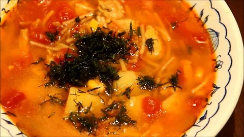 Soup with herbs in a bowl Stock Footage 77862732