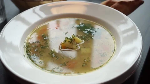 Soup in a large plate Stock Footage 159897408
