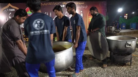 Soup in making inside large cooking pot over big gas stove Stock Footage 267508888