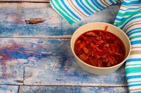 The soup in the plate on the table. Lunch in rustic style. Stock Photos
