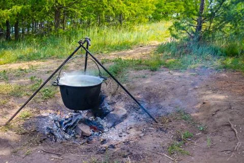 Soup in a pot in the fire Stock Photos