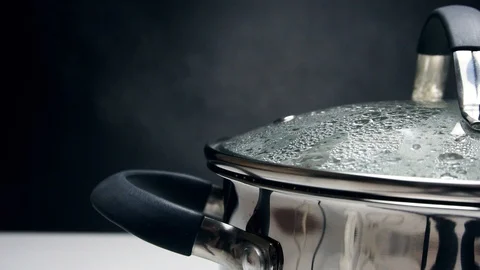 The soup should be cooked in a saucepan. Steam comes from the pan from under the Stock-Footage 89841000