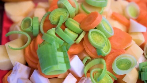 Soup vegetables cut into small pieces on a cutting board Stock Footage 124680027