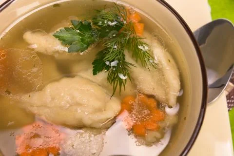 Soup with wheat dumplings Stock Photos