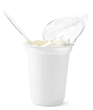 Sour cream in packaging on a white background. Isolated Stock Photos