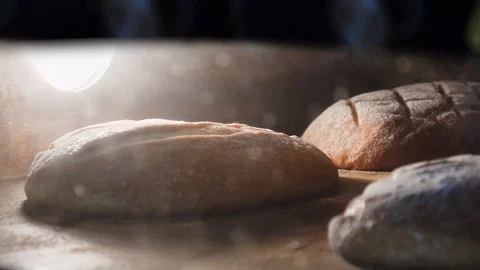 Sour dough artisan bread baking inside a hot oven Stock Footage 101215075