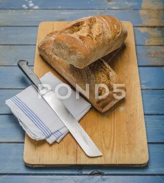 Sour Dough Bread On A Chopping Board With A Knife Stock Images Page Everypixel