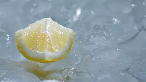 Sour lemon on cold ice rotates Stock Footage 107563558