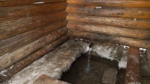 The source of artesian water flows in winter Christmas in the bitter cold Stock Footage 99632168