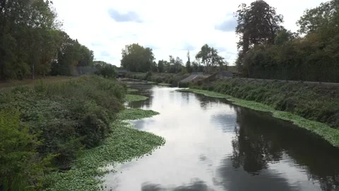 Source of a burst water main in Molesey, Surrey, which left thousands of people Stock Footage 346636438