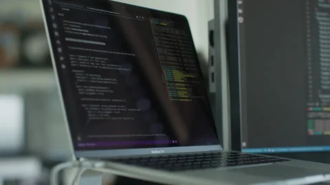 Source code of an an app or a website shown on a laptop in the office Video stock 146658100
